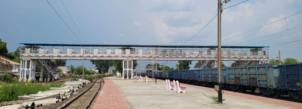 Completed FOB at platform with freight train